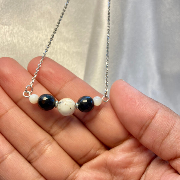 silver stainless steel gemstone necklace with howlite and black obsidian gemstones. Light Language infused jewelry for self love and energy healing 