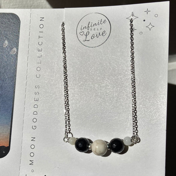 silver stainless steel gemstone necklace with howlite and black obsidian gemstones